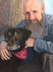 Bearded man with chocolate lab