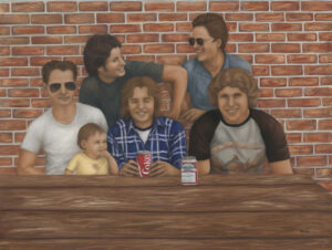 brothers sitting at picnic table laughing