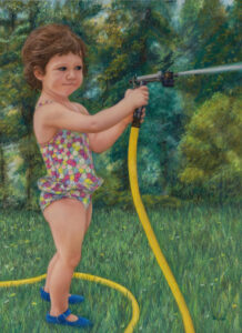 young girl in bathing suit spraying a garden hose